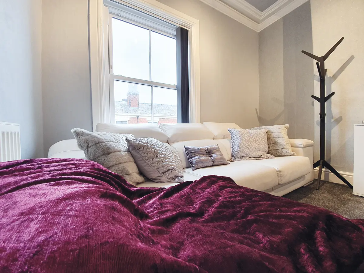 A comfortable seating area with premium furnishings inside the Pure White Smile laser teeth whitening treatment room in Chorley, Lancashire, designed to create a calm and welcoming boutique environment.