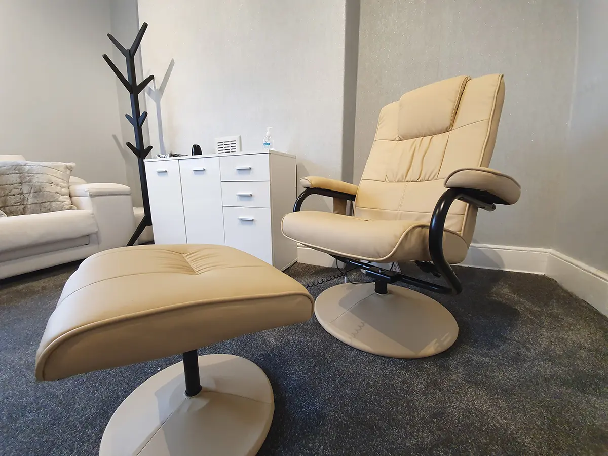 A premium massaging chair used by clients during their laser teeth whitening appointment inside the Pure White Smile treatment room in Chorley, designed for comfort and relaxation.