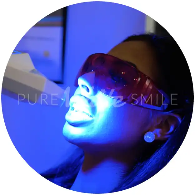 A client relaxing during step 6 while the Naturawhite Diamond Light 80W laser works to whiten their teeth as part of the laser teeth whitening treatment at Pure White Smile in Chorley.