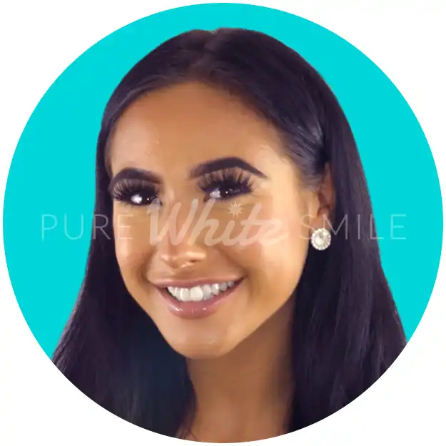 A happy client viewing their results during step 7, comparing tooth shade improvements after laser teeth whitening using the Naturawhite Diamond Light 80W and Blu Forsa gel at Pure White Smile in Chorley.